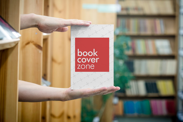 Book Mockup Featuring a Man in Library
