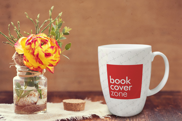 Ceramic Coffee Mug Next to Vase