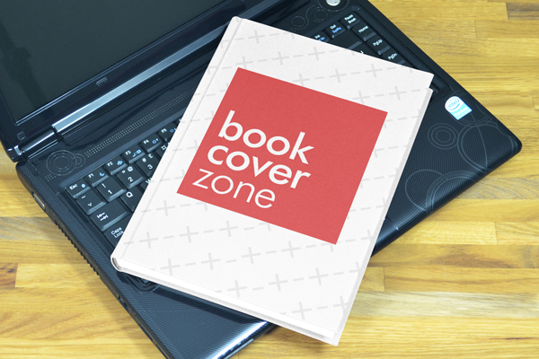 Hardcover Book Cover Mockup on Black Laptop