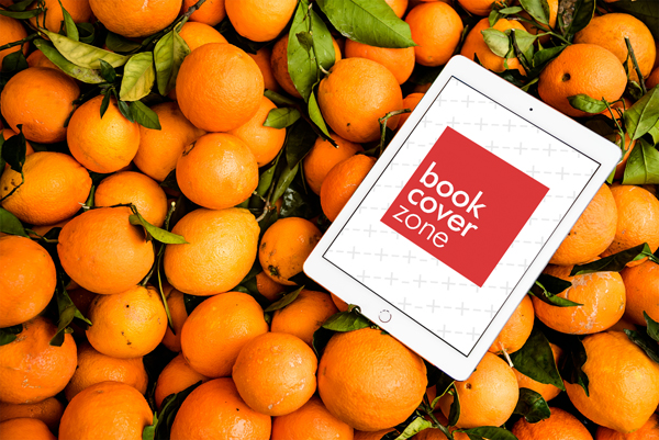 Mockup of a White iPad Tablet on Oranges