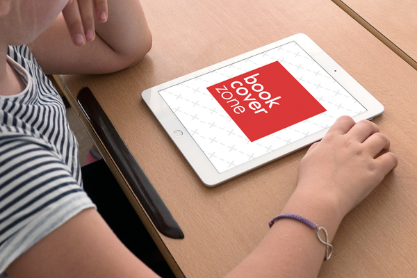 Young Boy Using iPad at School