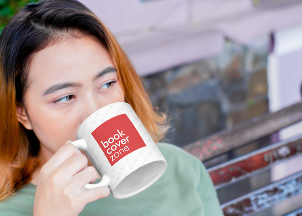 Mockup of a Young Woman Enjoying Coffee