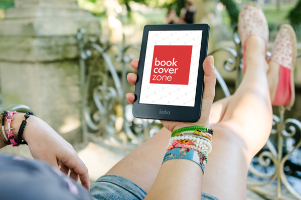 Woman Reading Digital E-Book Outdoors